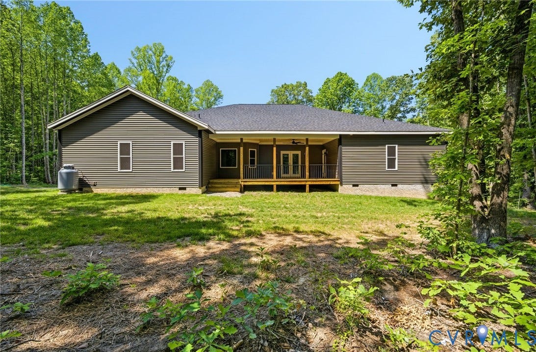 6995 Jefferson Highway, Louisa, VA 23117 Rear exterior featuring dark gray siding and a covered wooden deck