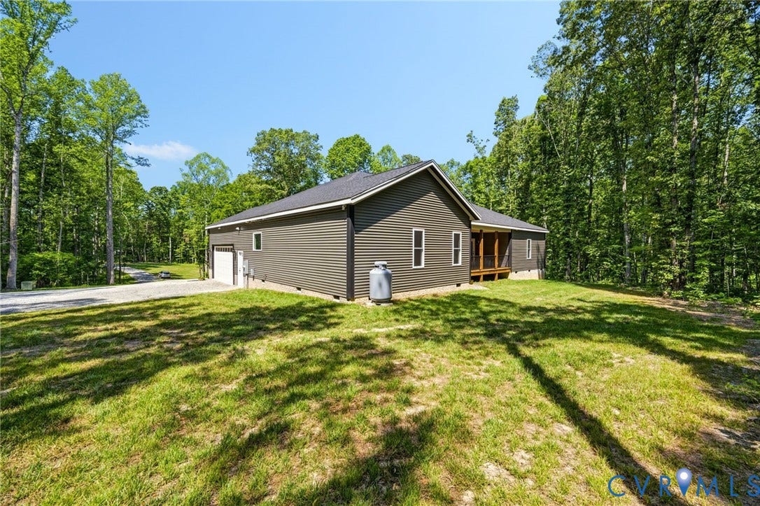 6995 Jefferson Highway, Louisa, VA 23117 Modern ranch-style residence featuring dark gray siding and a black shingle roof