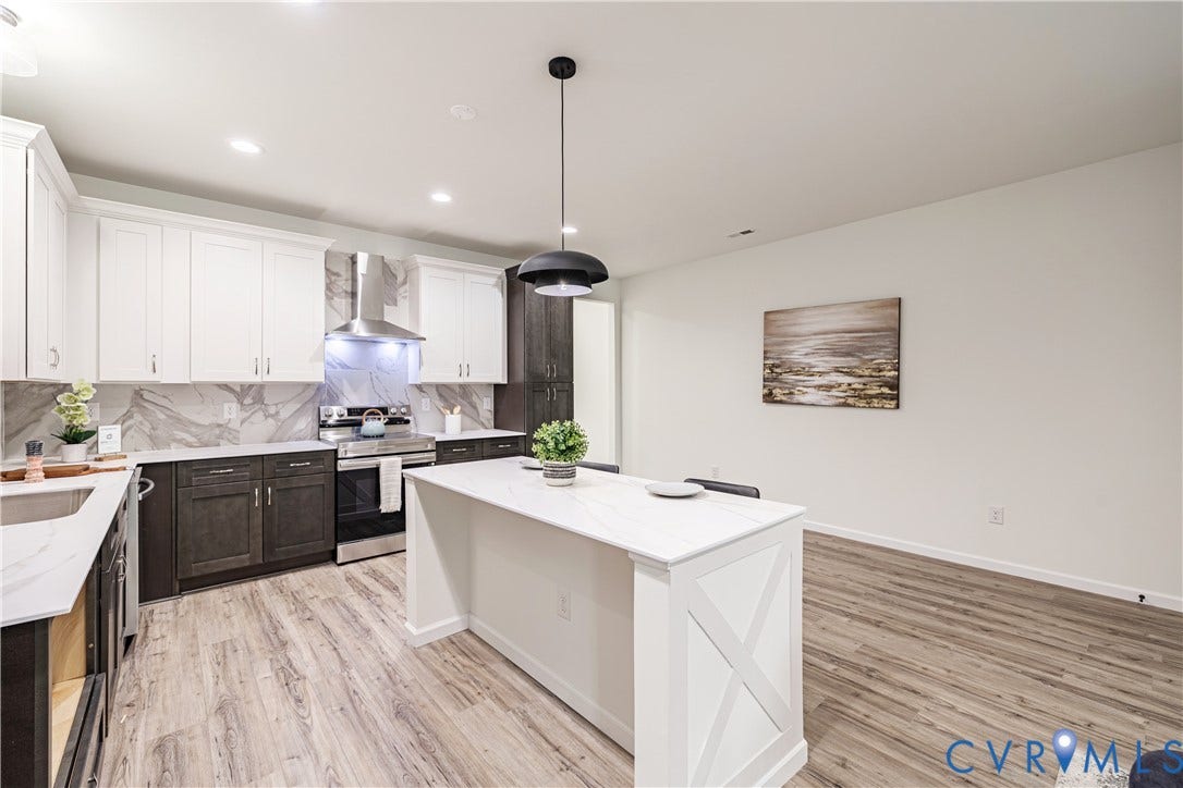 1514 Custer Street, Richmond, VA 23222 Modern kitchen featuring a central island with a white countertop and X-frame detailing