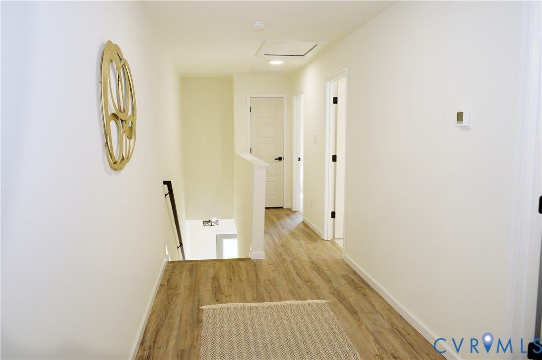 1514 Custer Street, Richmond, VA 23222 Hallway featuring wood-finish flooring, white walls, and white trim