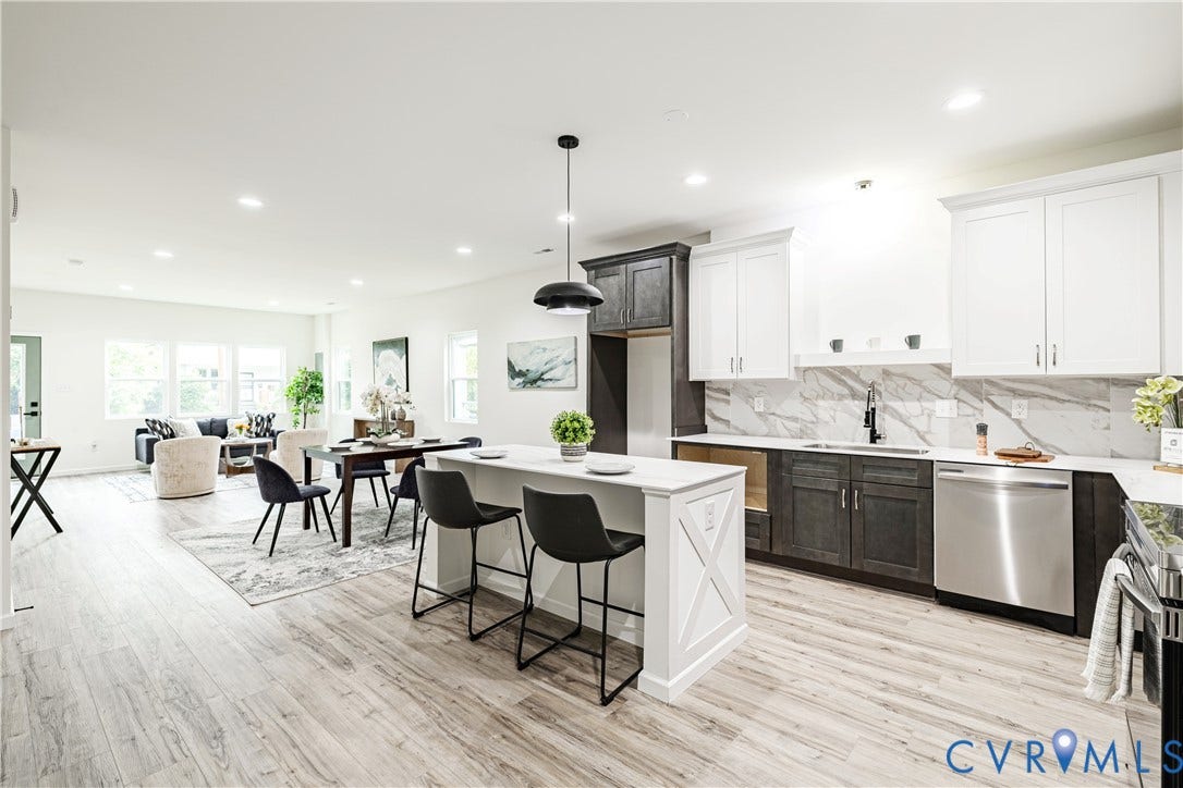 1514 Custer Street, Richmond, VA 23222 Open-concept living area featuring wood-finish flooring, recessed lighting, and ample natural light from multiple windows