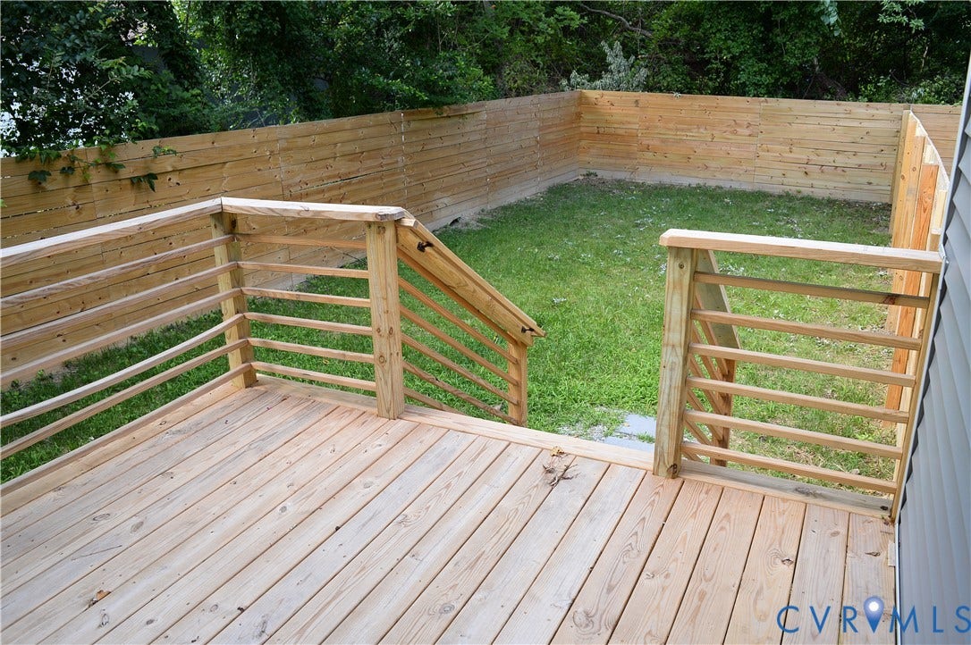 1514 Custer Street, Richmond, VA 23222 Wood deck with horizontal railings and steps leading to a fenced yard