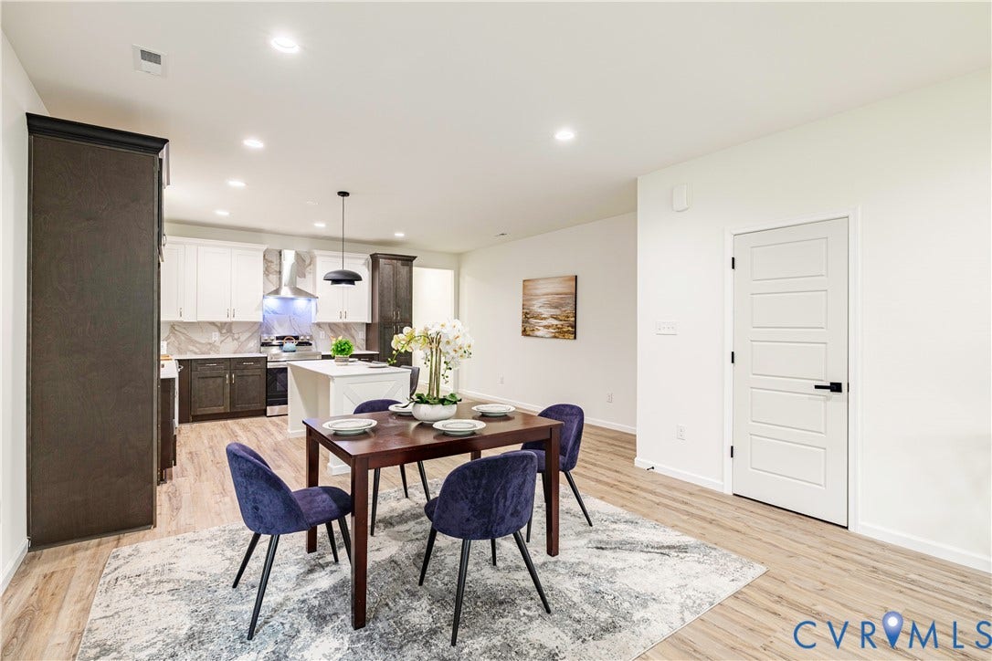 1514 Custer Street, Richmond, VA 23222 Open-concept dining area with wood-finish flooring, recessed lighting, and a five-panel interior door