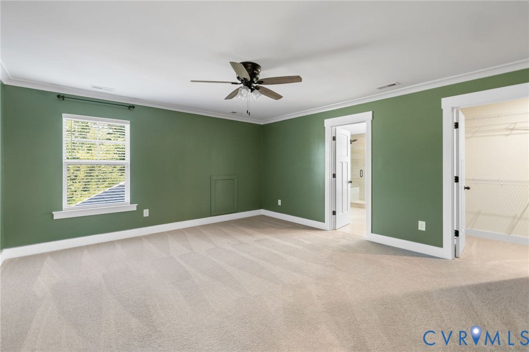 2nd floor primary suite. Recessed lighting, ceiling fan, carpeting, window with blinds, and white trim