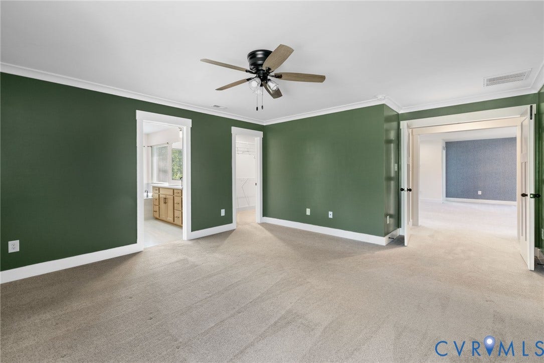 2nd floor primary suite. Carpeted interior with crown molding and a ceiling fan