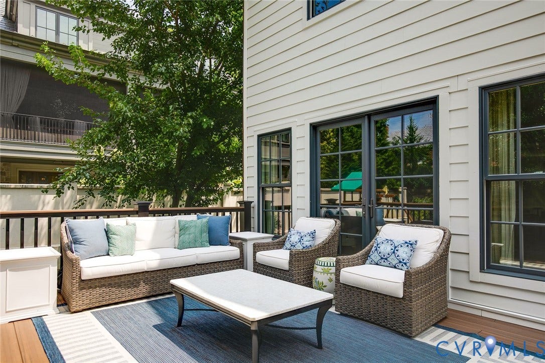 14 Libbie Avenue, Libbie/Grove, Richmond, VA 23226 Spacious outdoor deck featuring wood-finish flooring, dark wood railings, and cream-colored siding