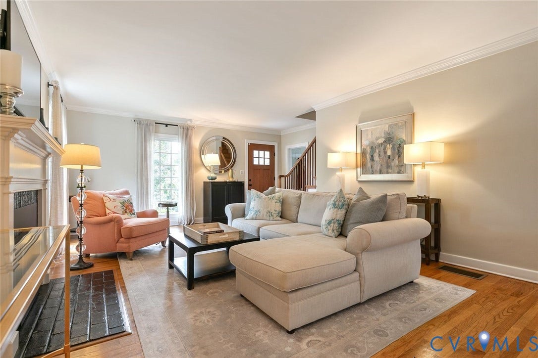 14 Libbie Avenue, Libbie/Grove, Richmond, VA 23226 Inviting living space featuring wood-finish flooring, a traditional fireplace with a white mantel, and crown molding
