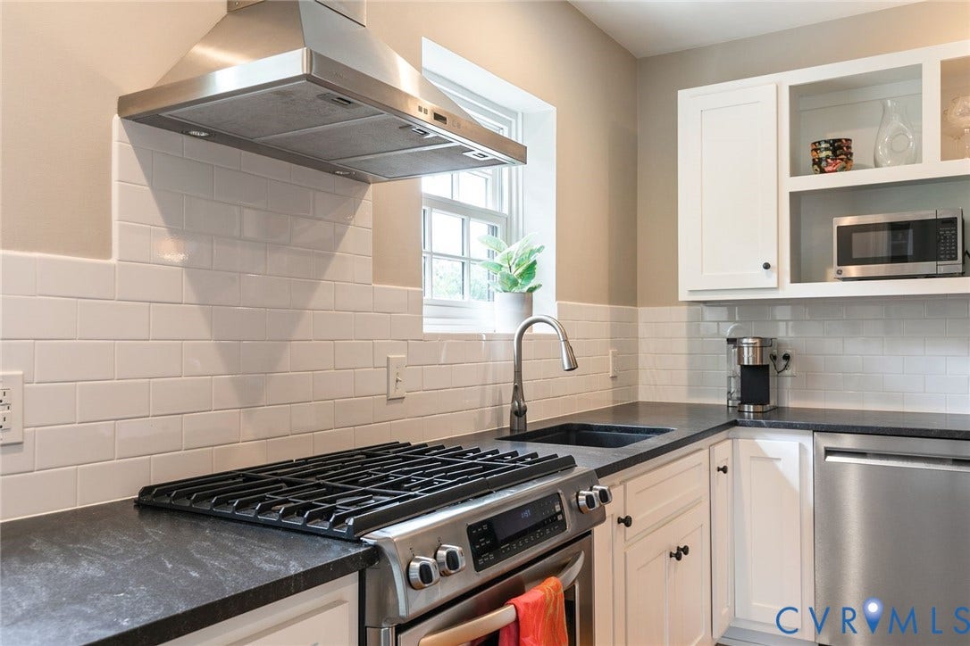 14 Libbie Avenue, Libbie/Grove, Richmond, VA 23226 Contemporary kitchen featuring white shaker cabinetry and a dark countertop