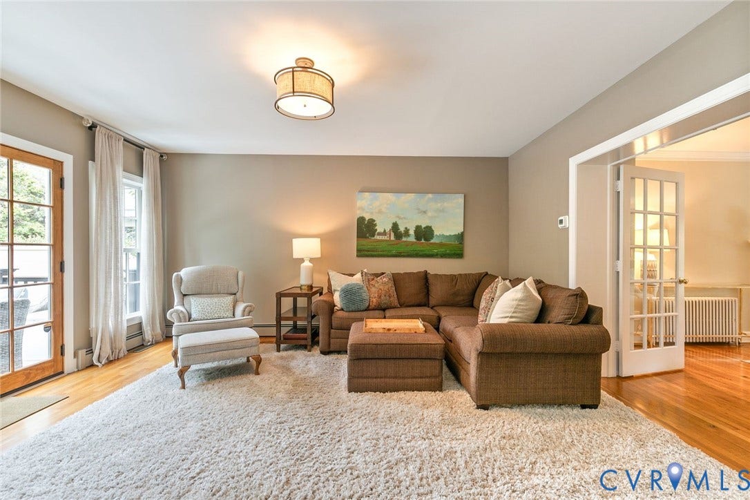 14 Libbie Avenue, Libbie/Grove, Richmond, VA 23226 Living area featuring a light-toned wall color, hardwood flooring, and an overhead drum light fixture