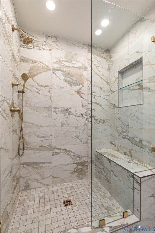 14 Libbie Avenue, Libbie/Grove, Richmond, VA 23226 Walk-in shower featuring full-height marble-look wall tiling, a built-in bench, and a glass-enclosed entry