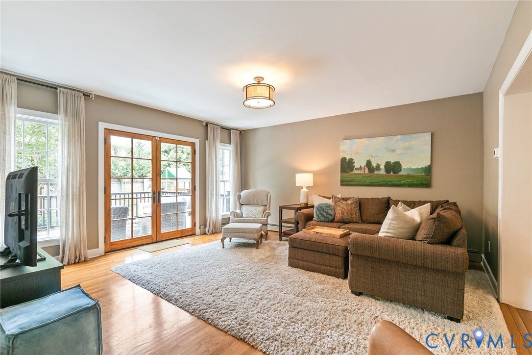 14 Libbie Avenue, Libbie/Grove, Richmond, VA 23226 Living area featuring wood-finish flooring, light-toned wall paint, and a ceiling-mounted light fixture