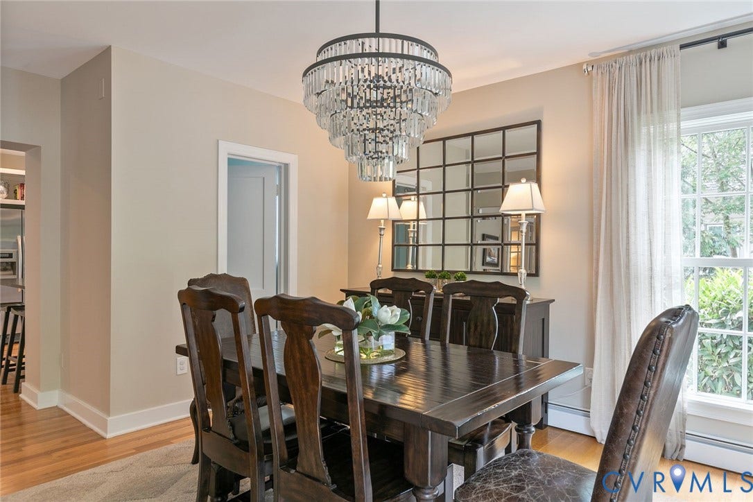 14 Libbie Avenue, Libbie/Grove, Richmond, VA 23226 Dining area featuring a prominent tiered crystal chandelier