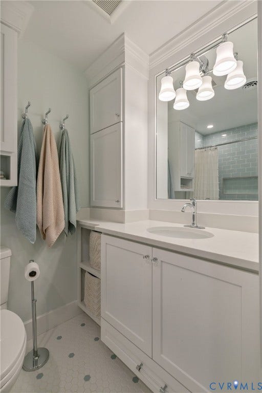 14 Libbie Avenue, Libbie/Grove, Richmond, VA 23226 Bathroom vanity featuring a white countertop, under-mount sink, and chrome faucet