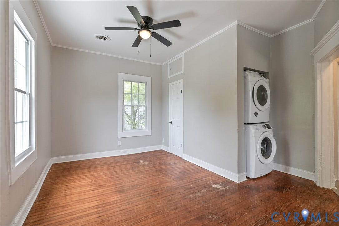 2801 4th Avenue, Richmond, VA 23222 Room featuring wood-finish flooring, two windows, and a ceiling fan