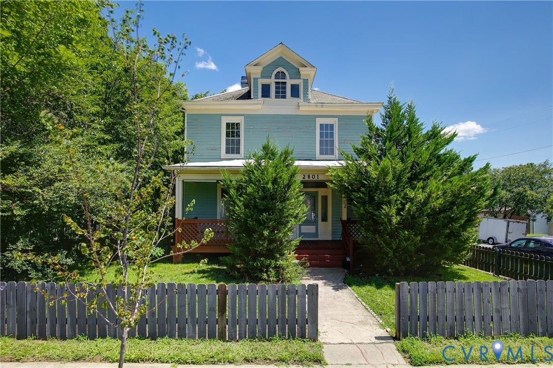 2801 4th Avenue, Richmond, VA 23222 Two-story residence featuring a powder blue exterior and white trim