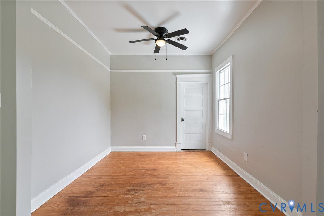 2801 4th Avenue, Richmond, VA 23222 Room featuring wood-finish flooring, light gray walls, and white trim
