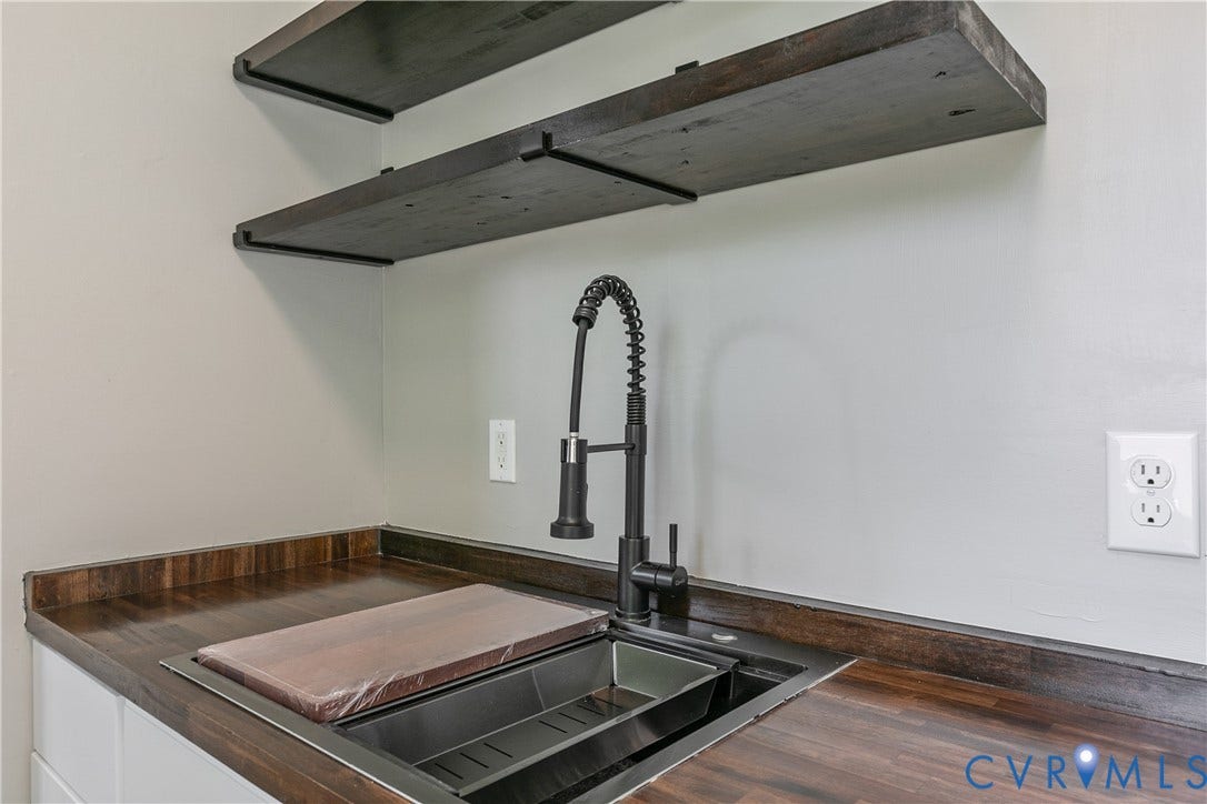 2801 4th Avenue, Richmond, VA 23222 Butcher block countertops with an undermount sink and matte black gooseneck faucet
