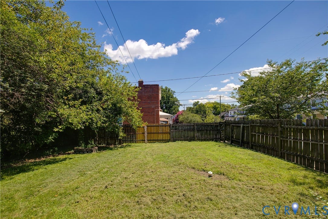 2801 4th Avenue, Richmond, VA 23222 Fenced backyard with established perimeter trees and a clear grass area