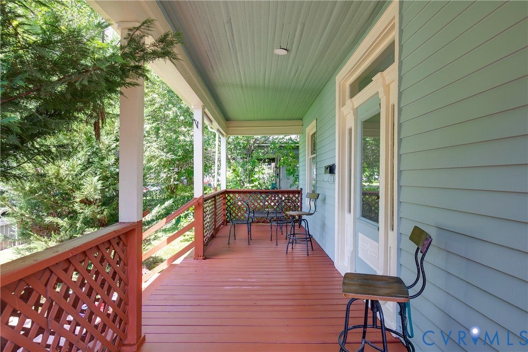 2801 4th Avenue, Richmond, VA 23222 Covered front porch featuring wood-finish flooring, lattice railing, and beadboard ceiling