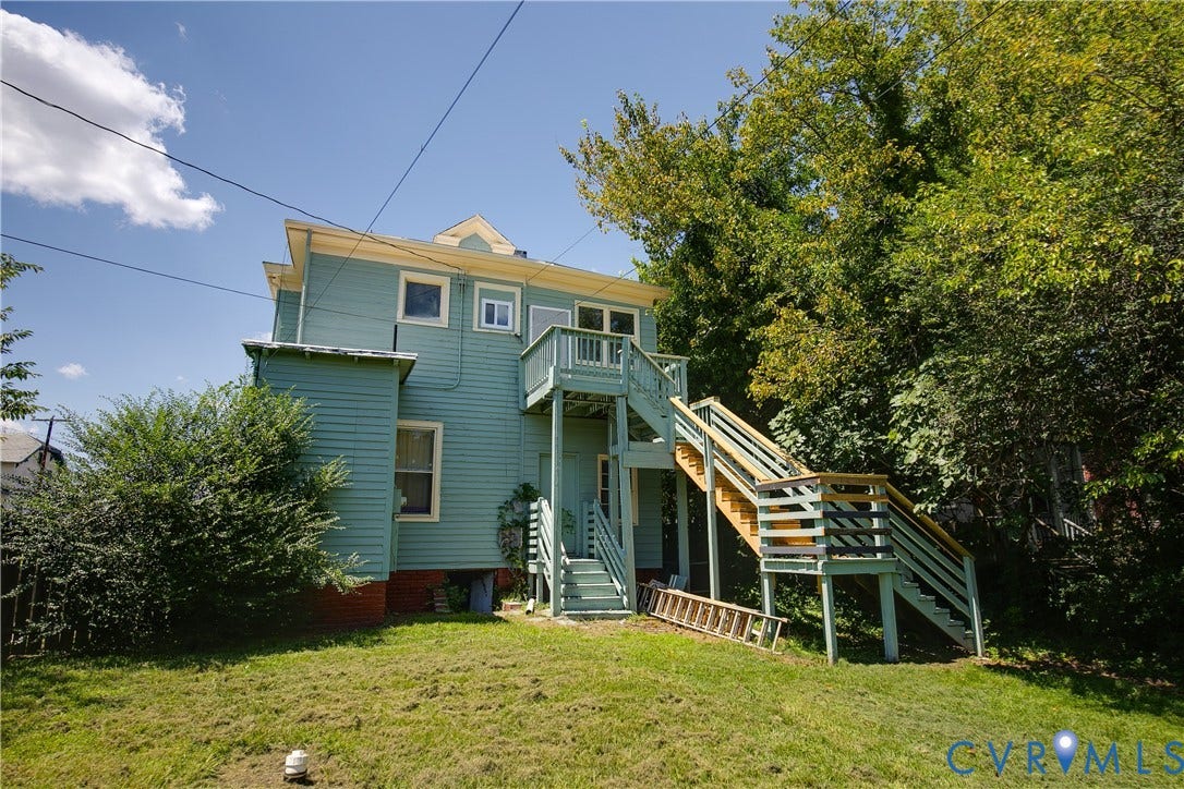 2801 4th Avenue, Richmond, VA 23222 Turquoise siding exterior featuring a gabled roofline and multiple windows