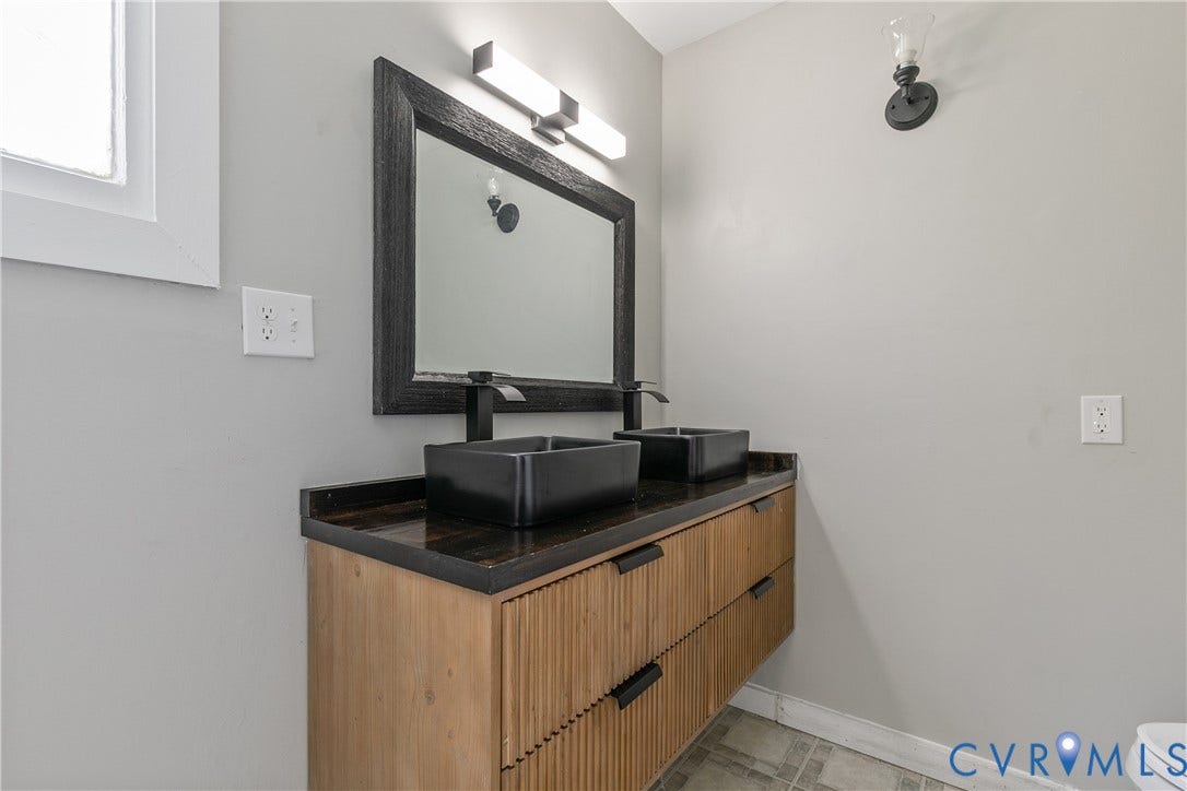 2801 4th Avenue, Richmond, VA 23222 Contemporary dual vanity with rectangular vessel sinks, matte black faucets, and a dark wood-finish countertop