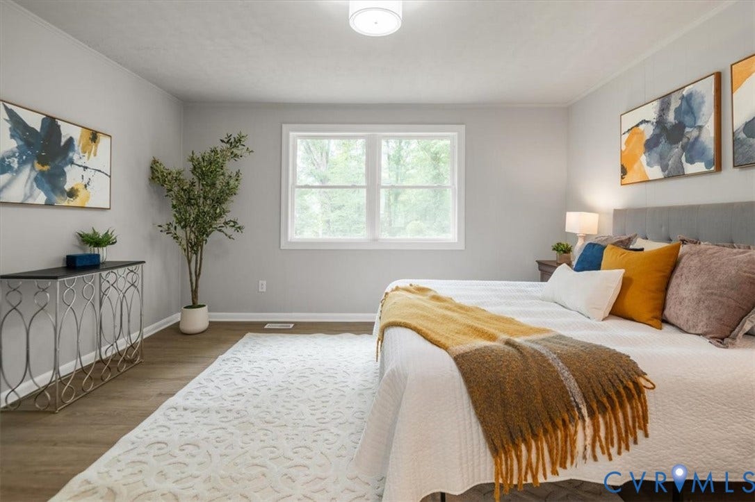 4400 Treely Road, Chesterfield, VA 23831 Bedroom with wood-finish flooring, a contemporary ceiling light fixture, and a large window