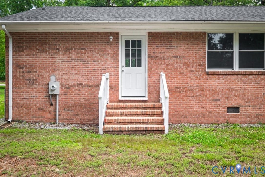 4400 Treely Road, Chesterfield, VA 23831 Brick exterior featuring a white paneled door with glass inserts, white handrails, and a window with white trim