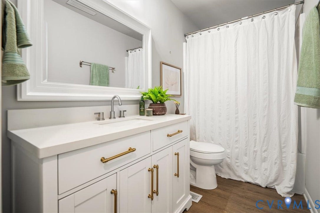 4400 Treely Road, Chesterfield, VA 23831 Modern vanity featuring a white countertop, undermount sink, and brushed nickel faucet