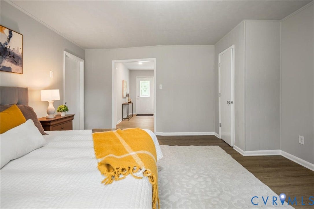 4400 Treely Road, Chesterfield, VA 23831 Light gray wall paint complemented by white trim and wood-finish flooring
