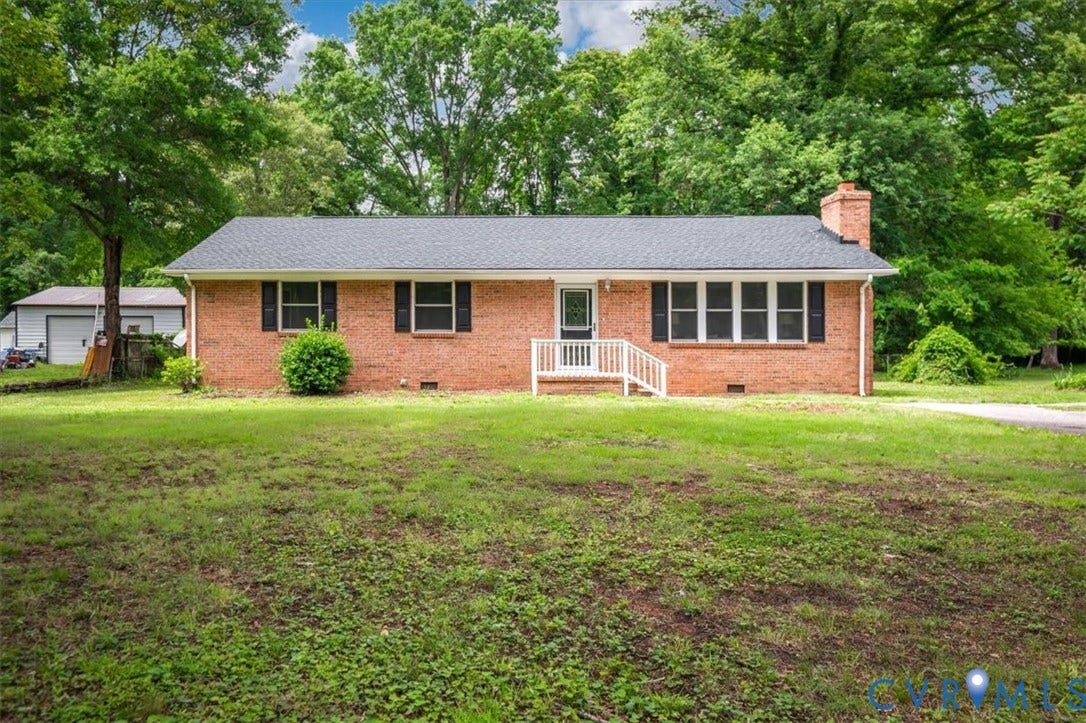 4400 Treely Road, Chesterfield, VA 23831 Brick ranch-style residence featuring a dark shingle roof, white entry railing, and a side chimney