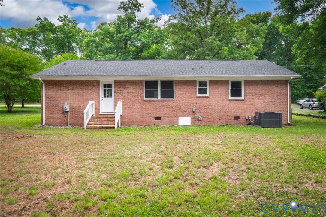 4400 Treely Road, Chesterfield, VA 23831 Brick ranch-style exterior featuring a white paneled door with glass inserts, white railings, and brick steps
