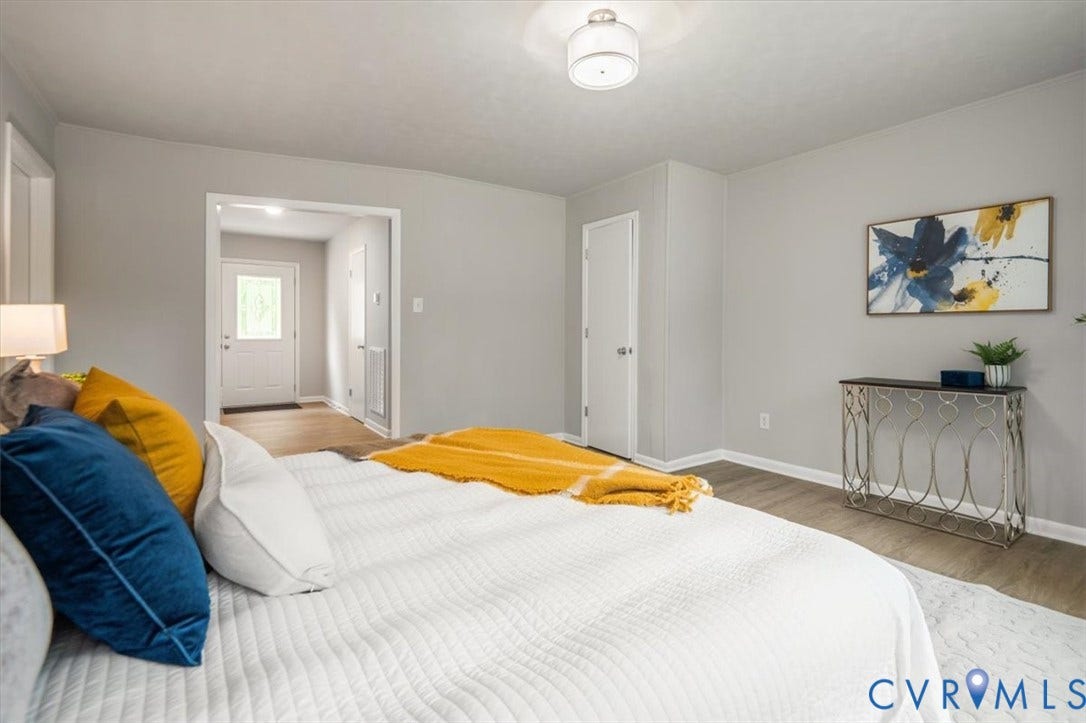 4400 Treely Road, Chesterfield, VA 23831 Spacious room featuring wood-finish flooring, light gray wall paint, and a semi-flush mount ceiling light