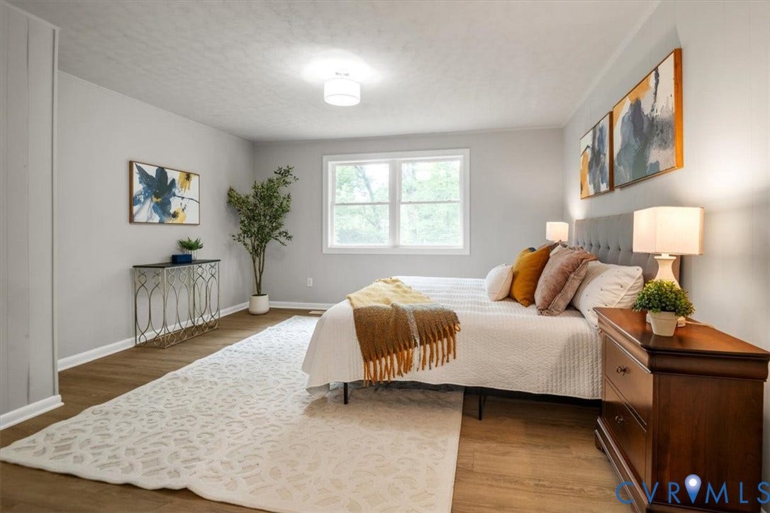 4400 Treely Road, Chesterfield, VA 23831 Spacious room featuring wood-finish flooring, light grey walls, and a large window