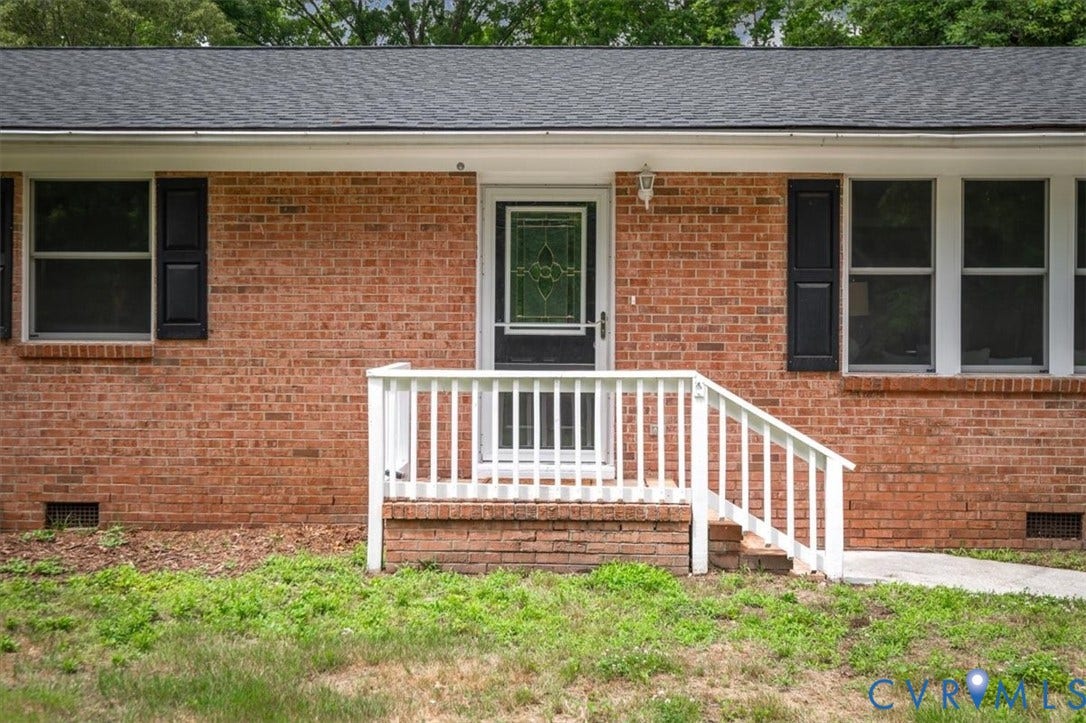 4400 Treely Road, Chesterfield, VA 23831 Brick facade home featuring a prominent front entrance with white railings