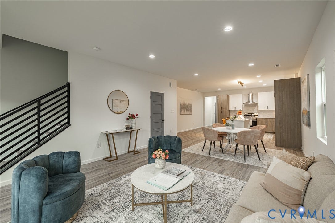 1516 Custer Street, Richmond, VA 23222 Open-concept living space featuring wood-finish flooring, recessed lighting, and a contemporary black metal staircase railing