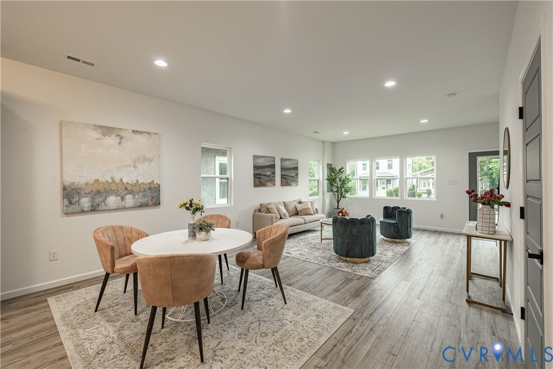 1516 Custer Street, Richmond, VA 23222 Open-concept living space featuring wood-finish flooring, recessed lighting, multiple windows, and a neutral color palette