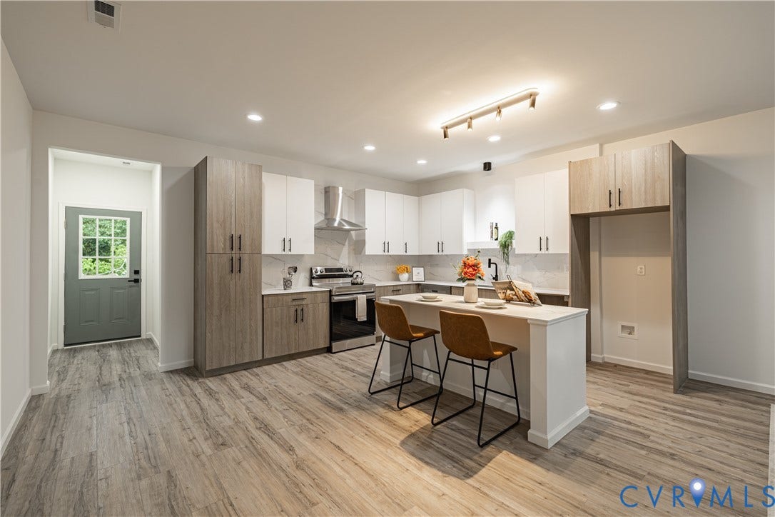 1516 Custer Street, Richmond, VA 23222 Modern kitchen featuring two-tone cabinetry, stainless steel appliances, a center island with seating, recessed lighting, and wood-finish flooring