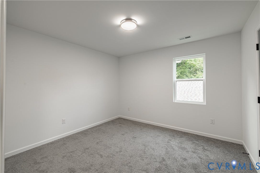 1516 Custer Street, Richmond, VA 23222 Carpeted room featuring a single window, white walls, and a flush-mount ceiling light