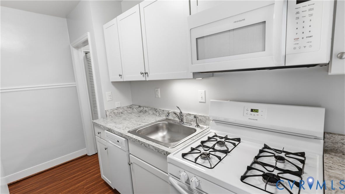 3517 Hanover Avenue, #B, Museum District, Richmond, VA 23221 Kitchen featuring white cabinetry, gray speckled countertops, a stainless steel sink, a white gas range, and an over-range microwave