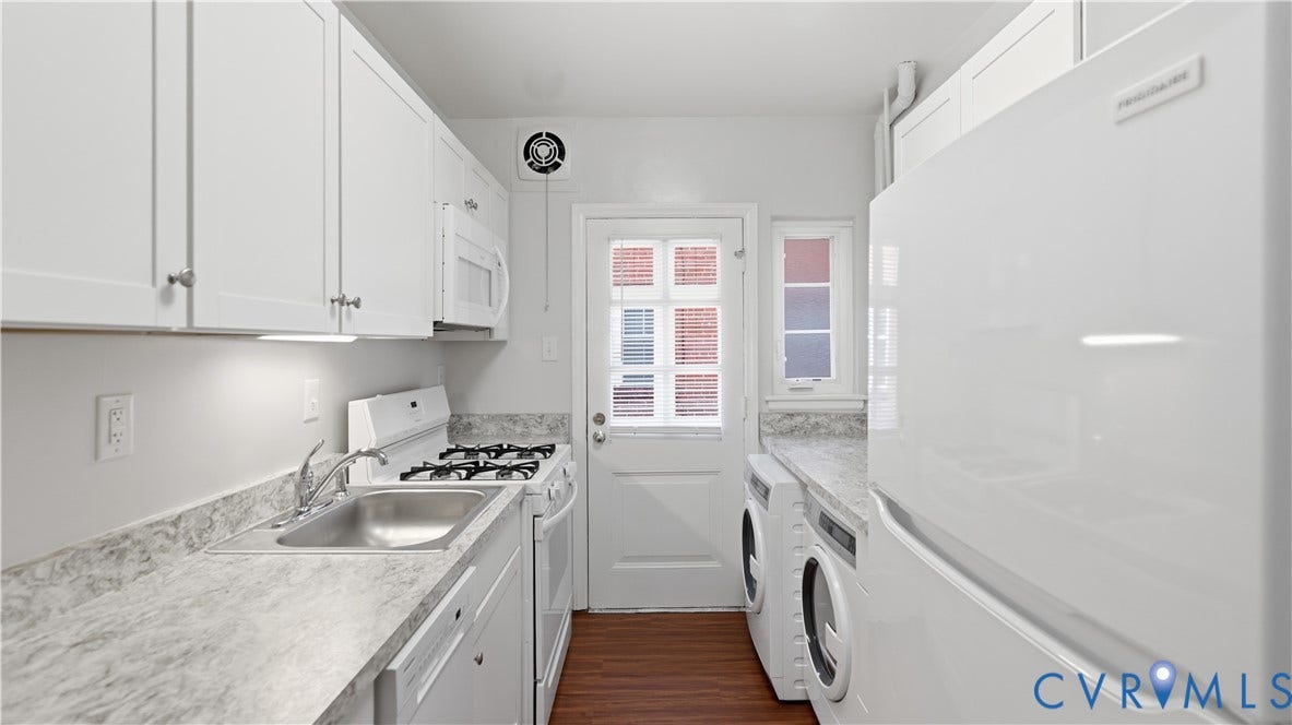 3517 Hanover Avenue, #B, Museum District, Richmond, VA 23221 Galley kitchen featuring white cabinetry, light countertops, wood-finish flooring, a white gas range, and a white refrigerator