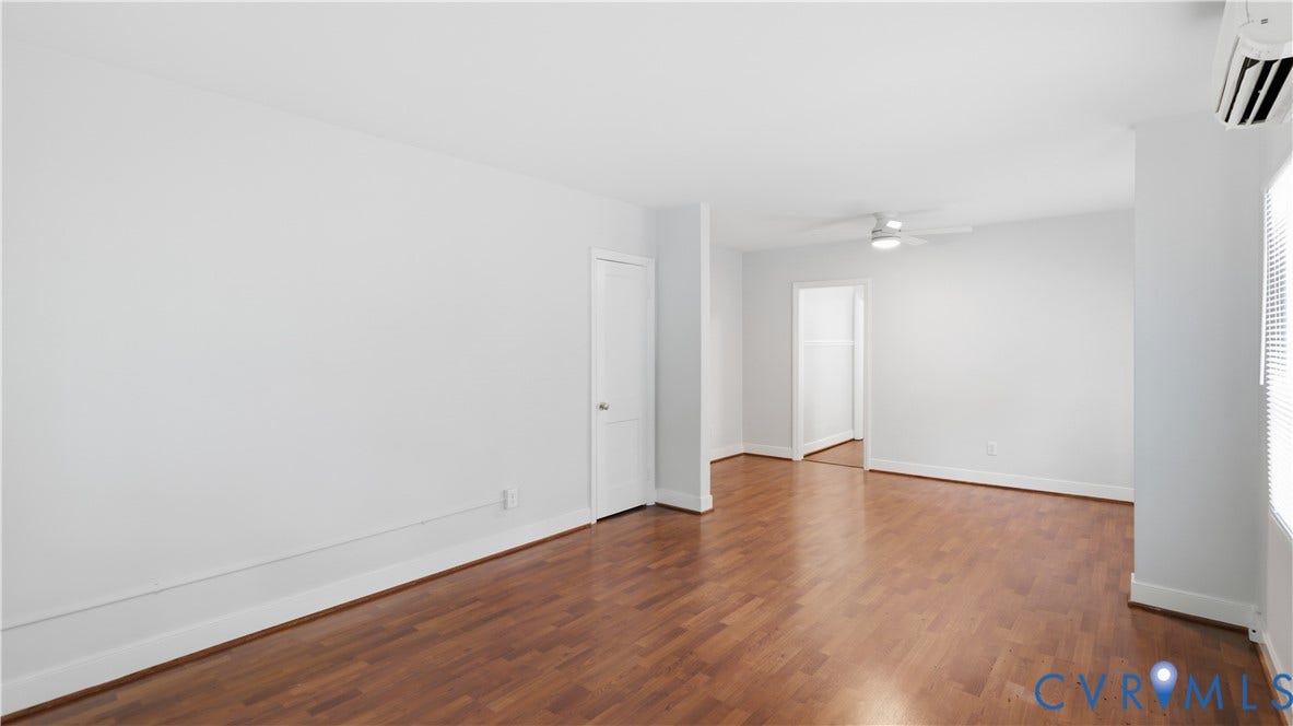 3517 Hanover Avenue, #B, Museum District, Richmond, VA 23221 Open concept room featuring wood-finish flooring, white baseboards, and a ceiling fan with integrated lighting