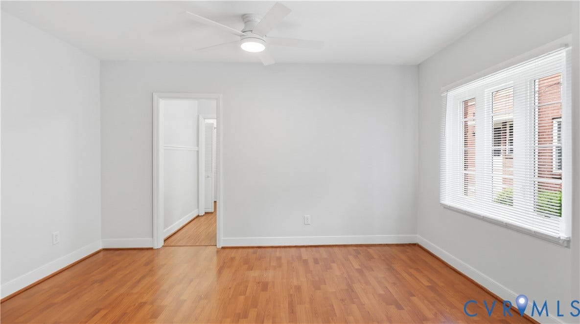 3517 Hanover Avenue, #B, Museum District, Richmond, VA 23221 Spacious interior room featuring wood-finish flooring, white baseboards, and a modern ceiling fan with integrated lighting