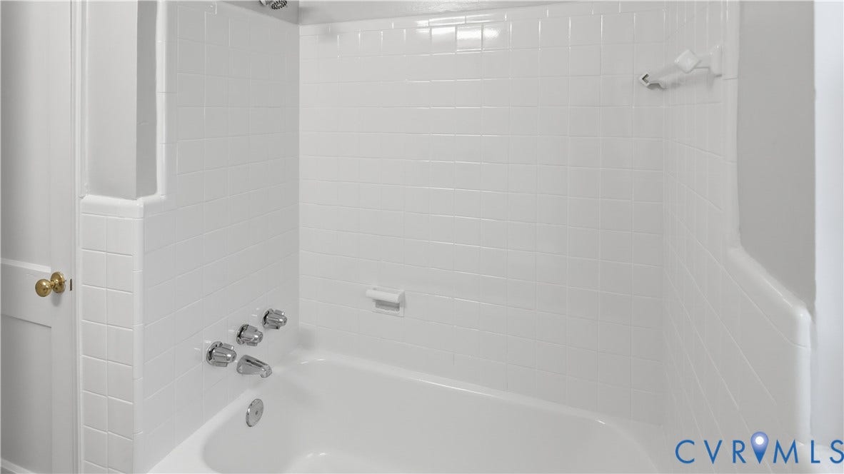 3517 Hanover Avenue, #B, Museum District, Richmond, VA 23221 White tiled tub and shower combination with chrome fixtures