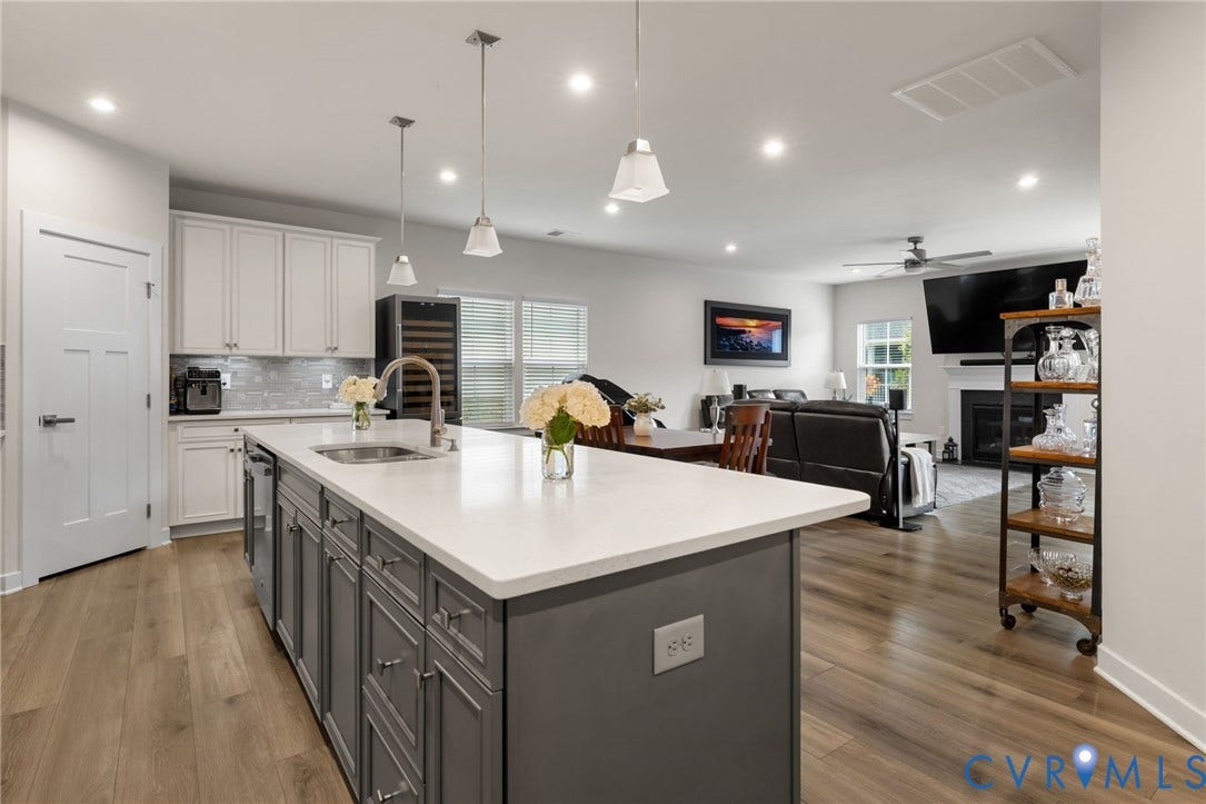 6249 Deer Summit Court, Charleston Club, Moseley, VA 23120 White shaker-style cabinetry, quartz countertops, stainless steel appliances, LVP, central island with seating