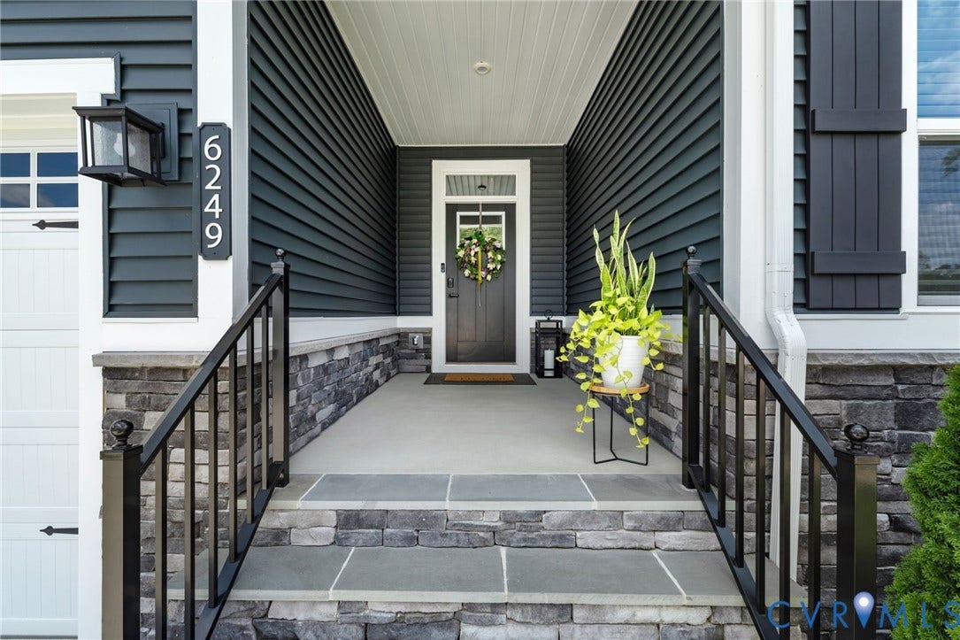 6249 Deer Summit Court, Charleston Club, Moseley, VA 23120 Covered back porch featuring a composite deck, white railing, white columns, and dark gray siding