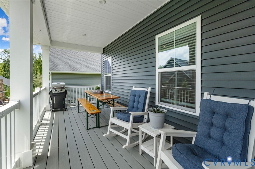 6249 Deer Summit Court, Charleston Club, Moseley, VA 23120 Covered back porch featuring a composite deck, white railing, white columns, and dark gray siding