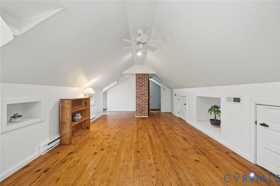 3633 Darbytown Court, Henrico, VA 23231 Spacious attic conversion featuring wood flooring, ceiling fan, and exposed brick accents