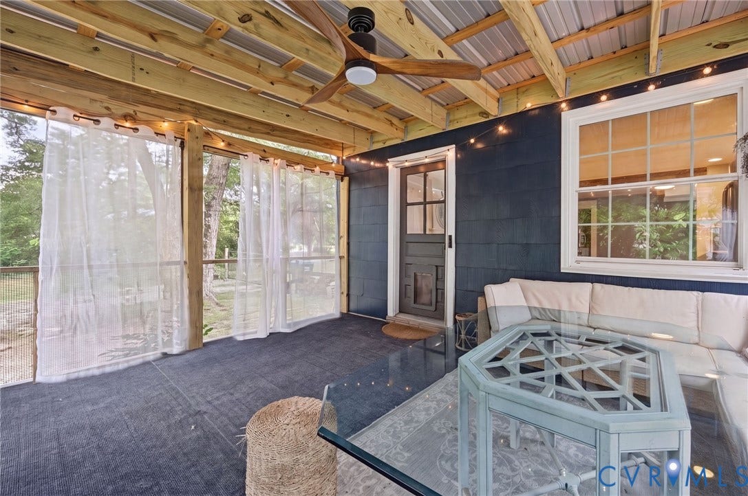3633 Darbytown Court, Henrico, VA 23231 Screened porch featuring exposed wood beams, a metal roof, and a ceiling fan