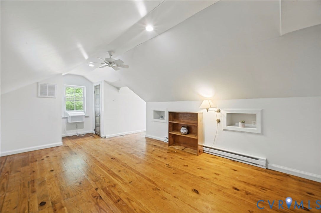 3633 Darbytown Court, Henrico, VA 23231 Attic space featuring wood-finish flooring, white vaulted ceilings, and a ceiling fan