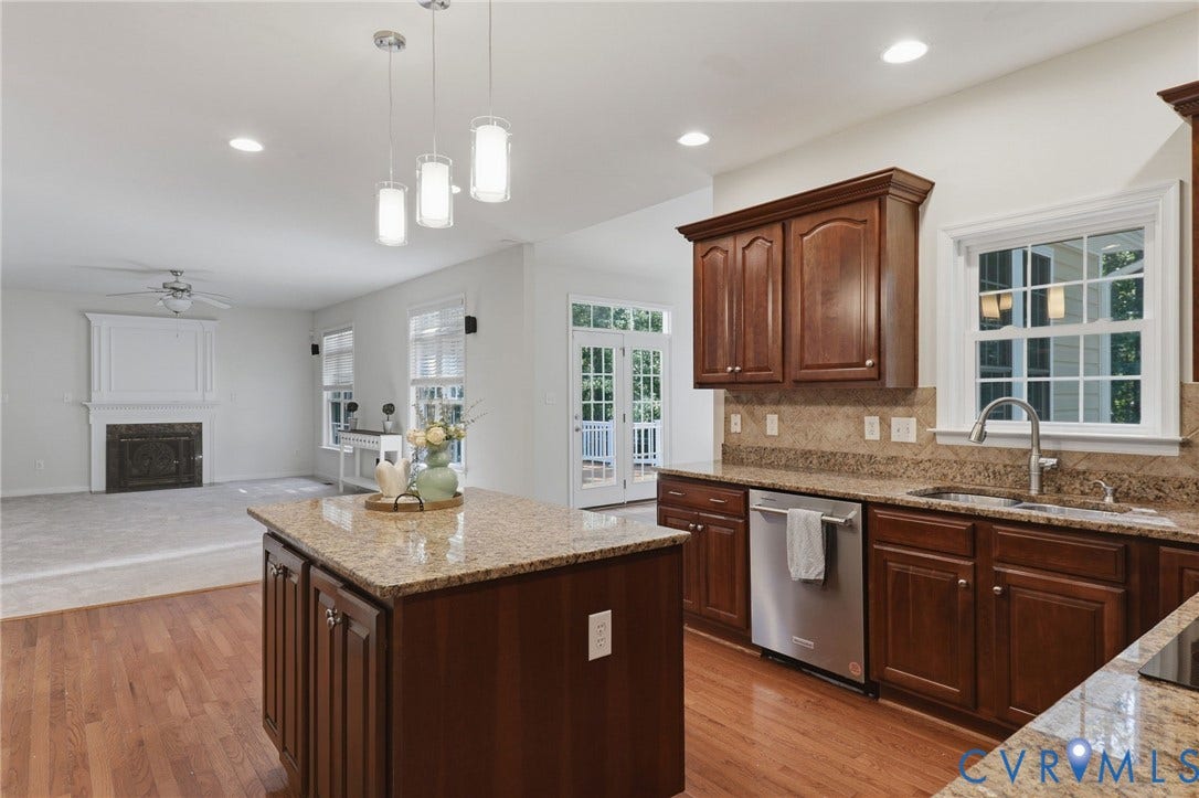 7618 Hampton Green Drive, Chesterfield, VA 23832 Kitchen island with granite countertop, wood-finish flooring, stainless steel dishwasher, wood cabinetry, and recessed lighting